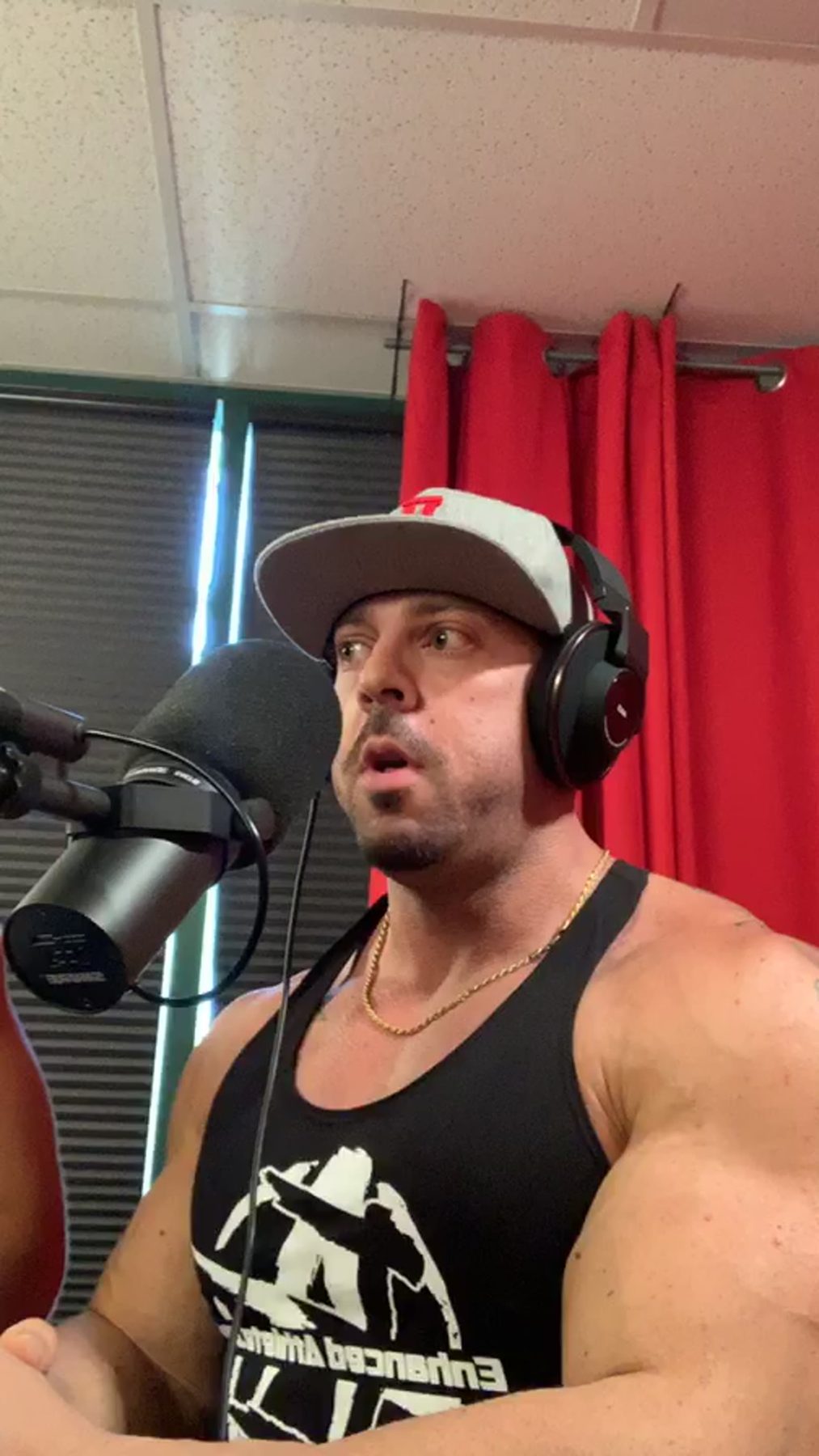 At the podcast microphone