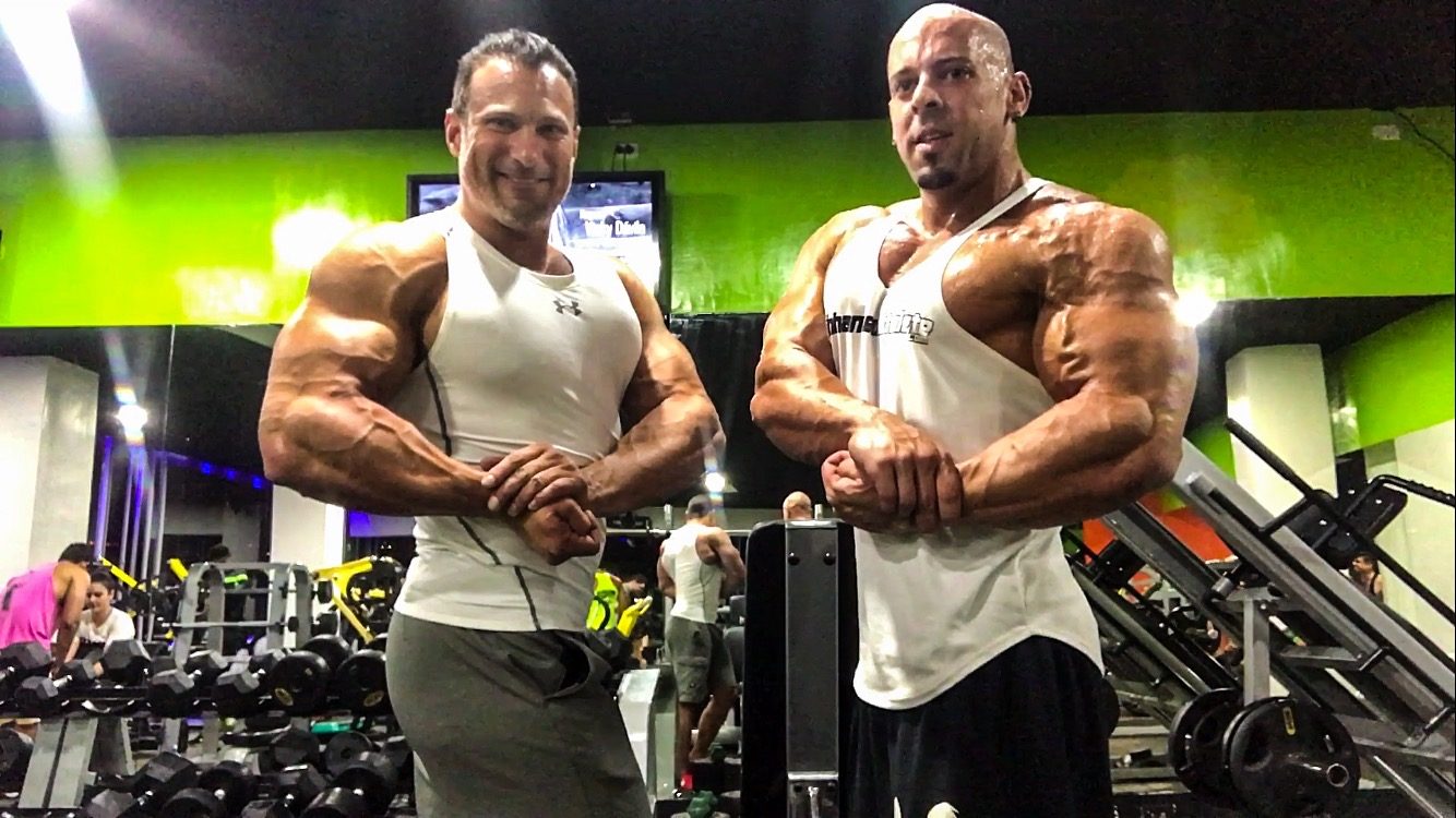 Tony Huge and Coach Trevor side by side in the gym